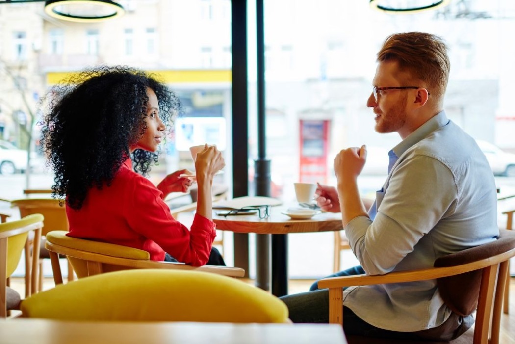 A man and women having coffee together at a cafe